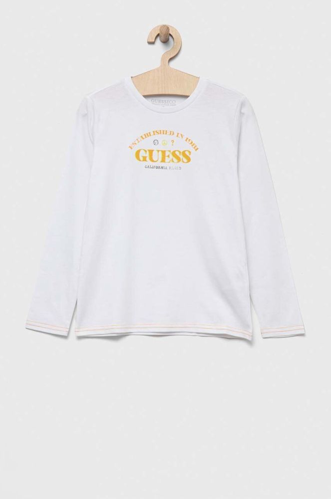 Дитячий бавовняний лонгслів Guess колір білий з принтом (3321918)