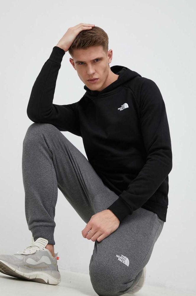 Бавовняна кофта The North Face чоловіча колір чорний з капюшоном з принтом NF0A2ZWUKY41-KY41